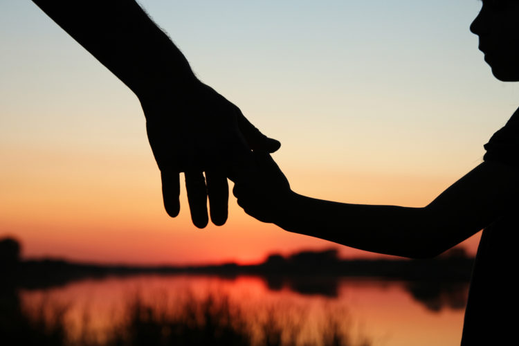 How to Deal with the Stress of a Divorce - silhouette parent and child hands